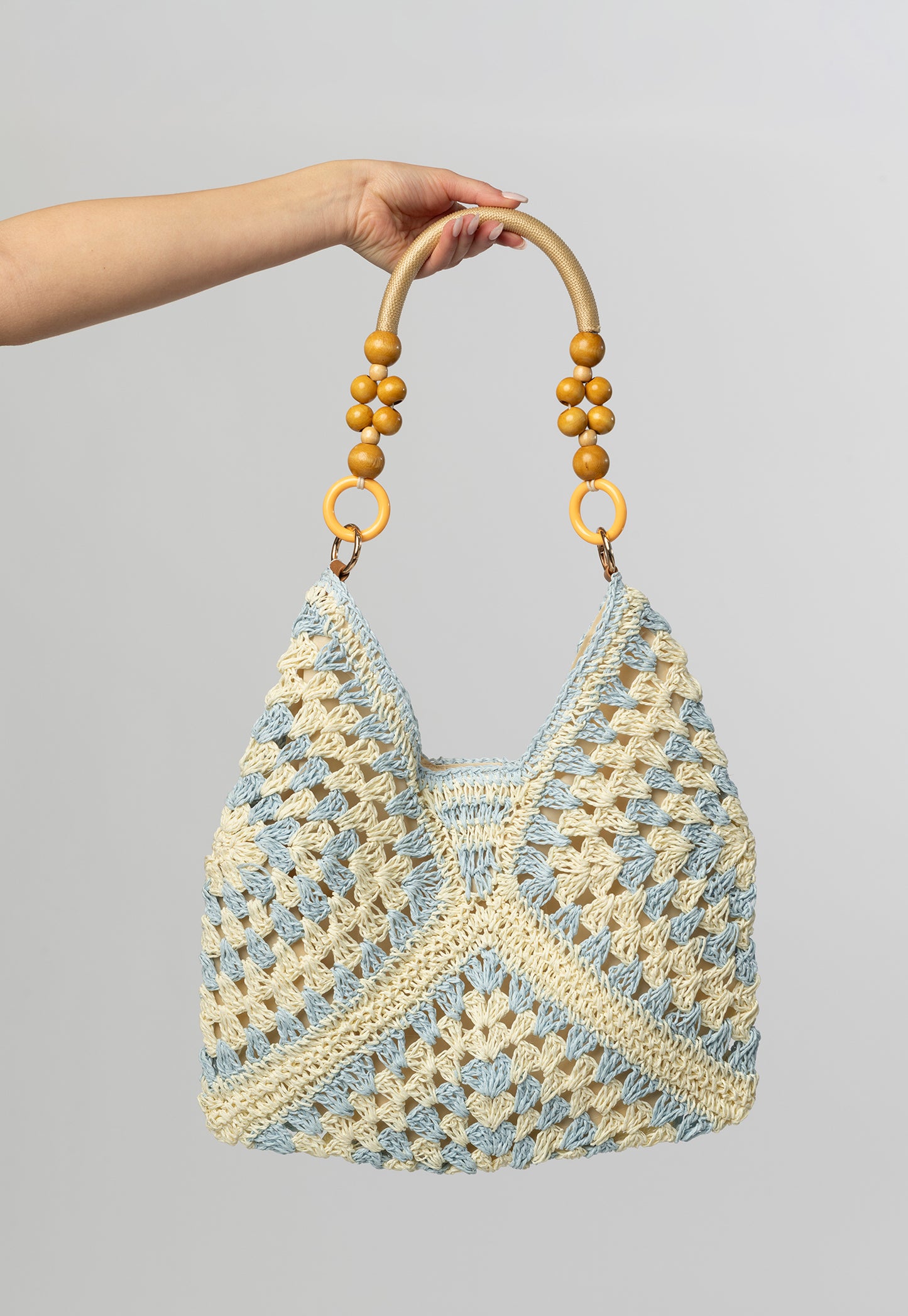Blue woven tote with beaded handle