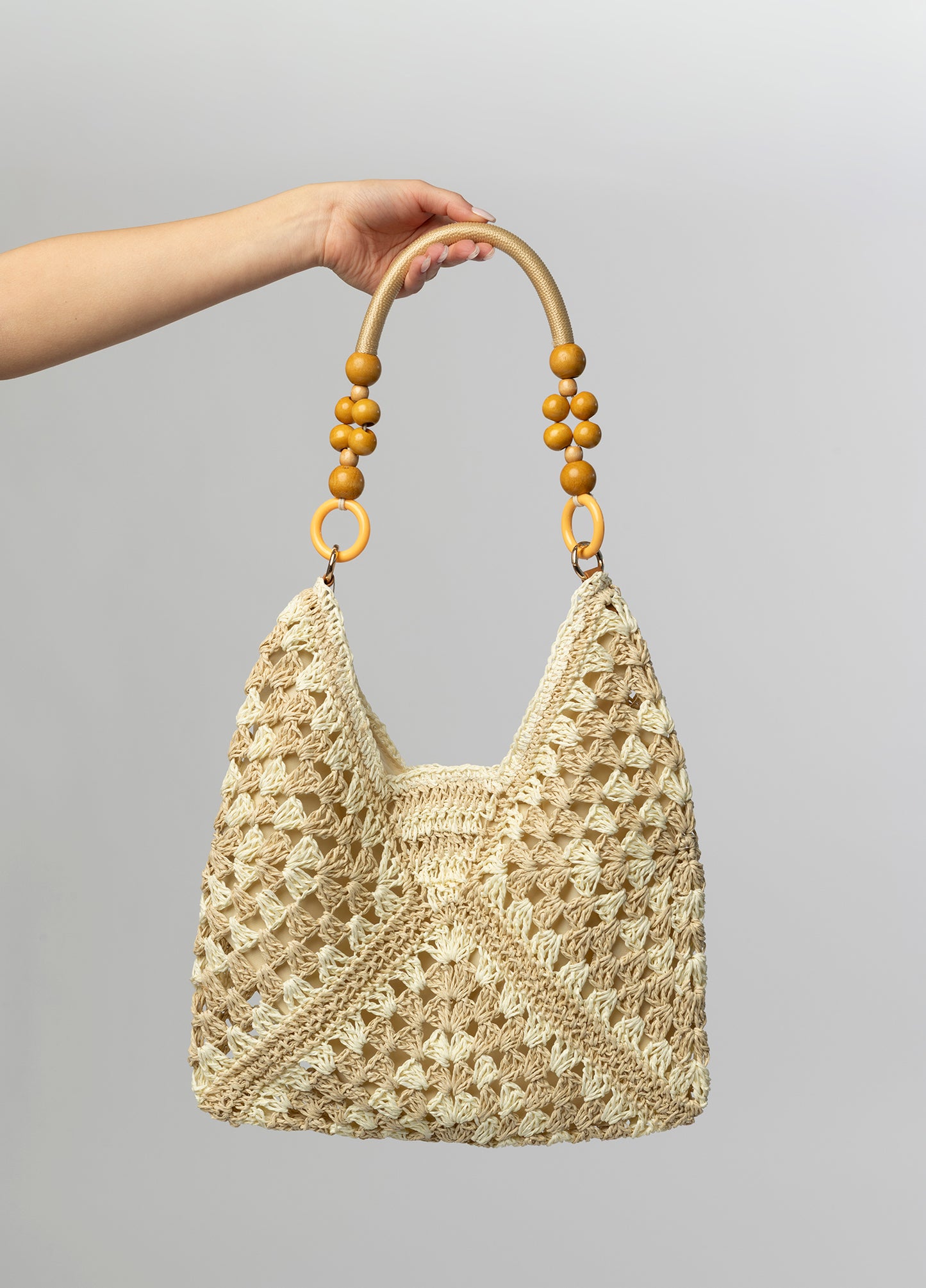 Cream woven tote with beaded handle
