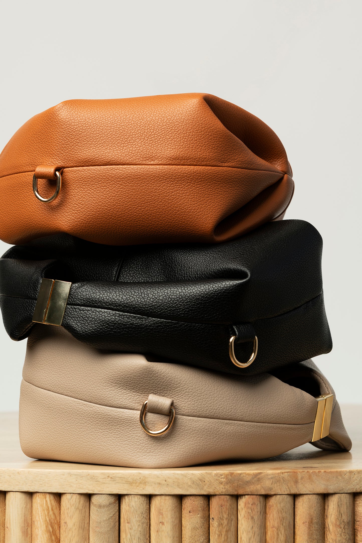 Beige leather top handle bag with buckle