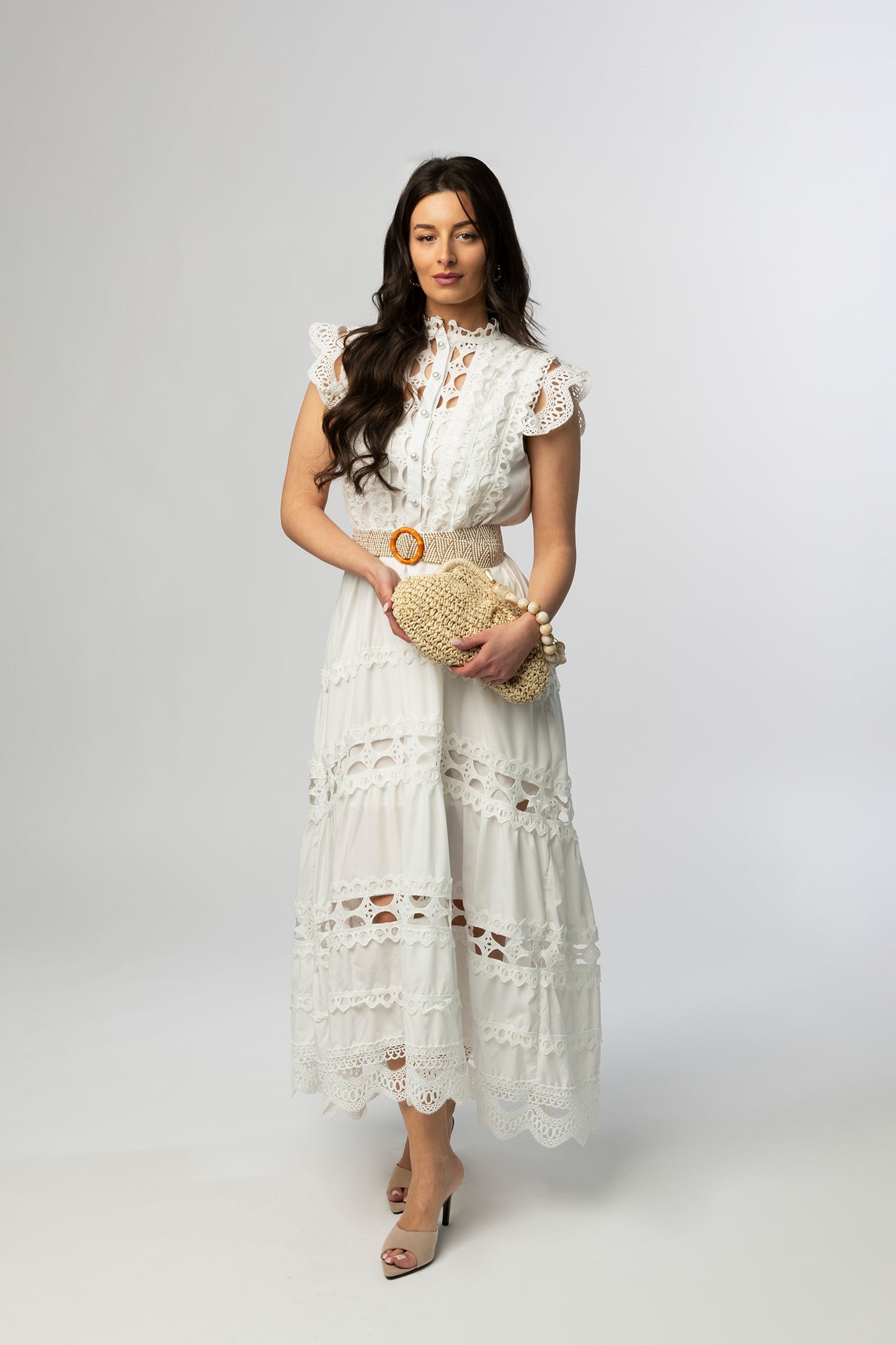 Beige woven clutch with beaded handle
