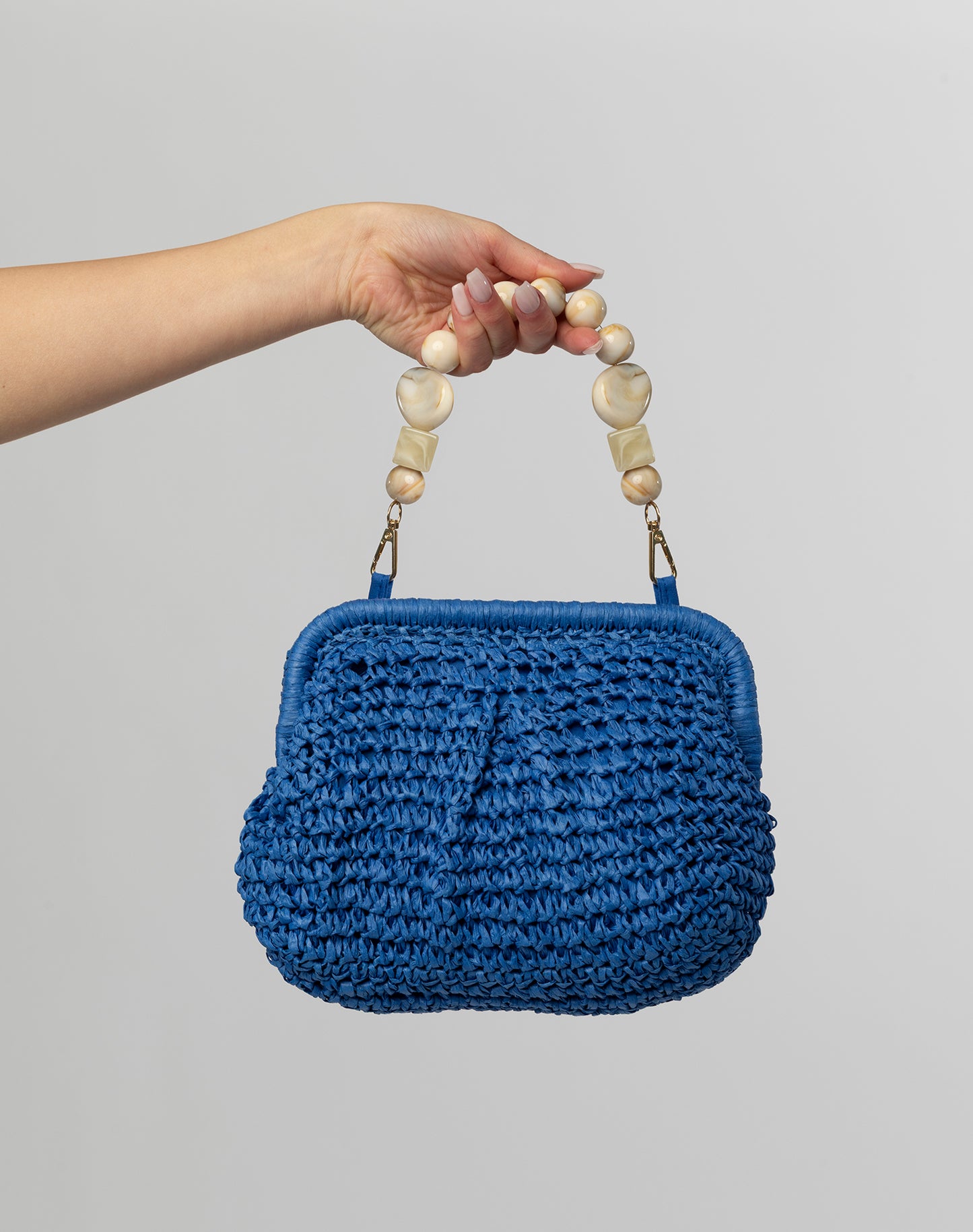 Cobalt woven clutch with beaded handle