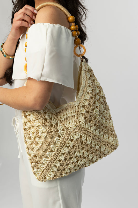 Cream woven tote with beaded handle