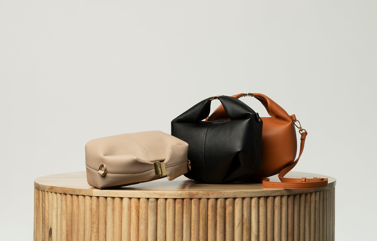 Black leather top handle bag with buckle