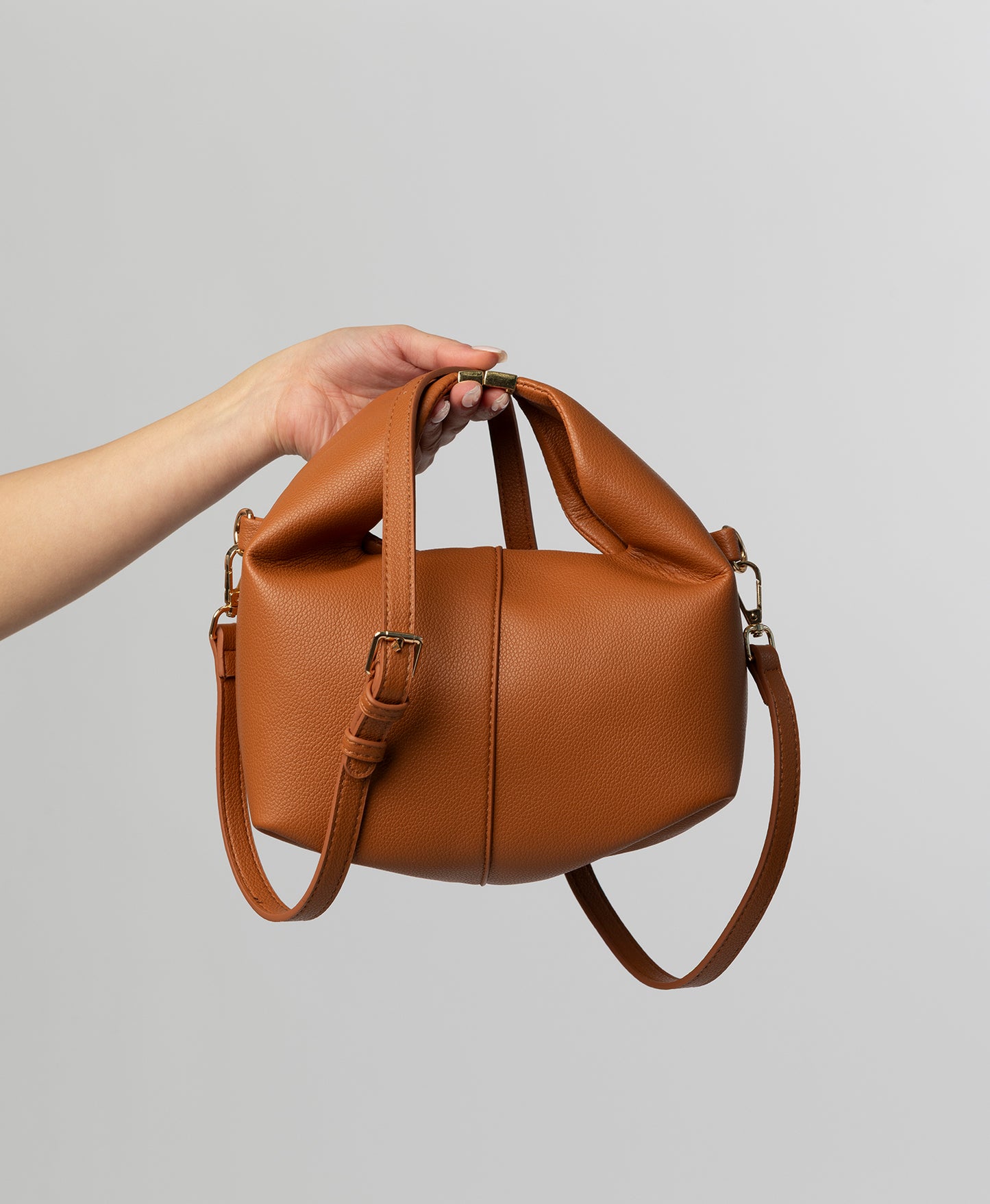 Camel leather top handle bag with buckle